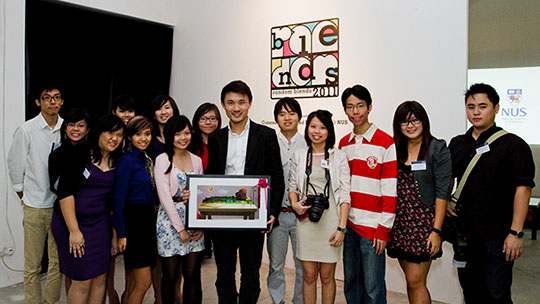 Photograph of the Random Blends 2011 committee members and the guest of honour, Mr Baey Yam Keng, taken on the opening night of the exhibition held at Old School.