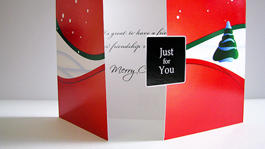 Photograph of an actual printed copy of the Just for You Christmas card.