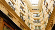 Photograph of the sky-lit atrium within The Fullerton Hotel, Singapore.