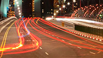 Photograph of motion blur light trails of vehicles moving towards Marina Bay Sands, Singapore.